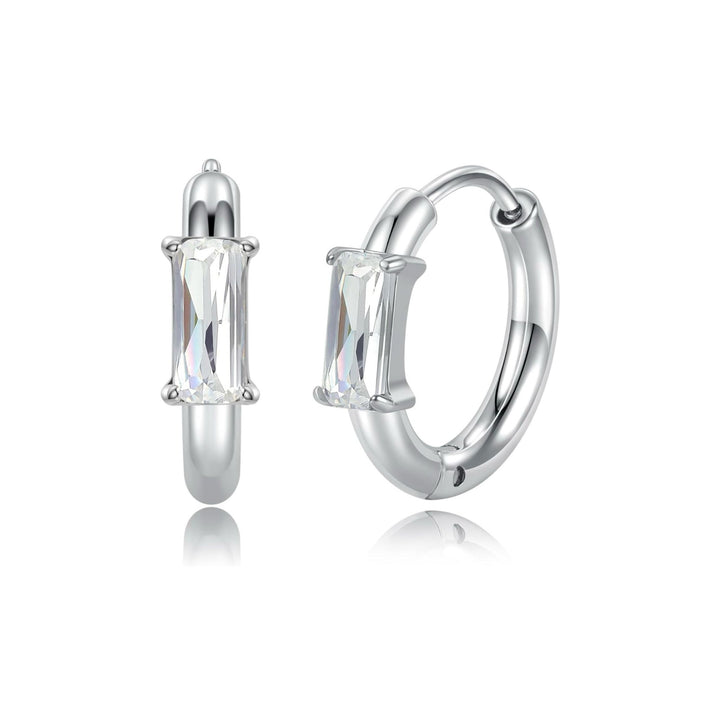 Zircon Huggie Hoop Earrings with gold-tone setting and zircon stones on white background
